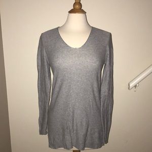 Grey vneck sweater.